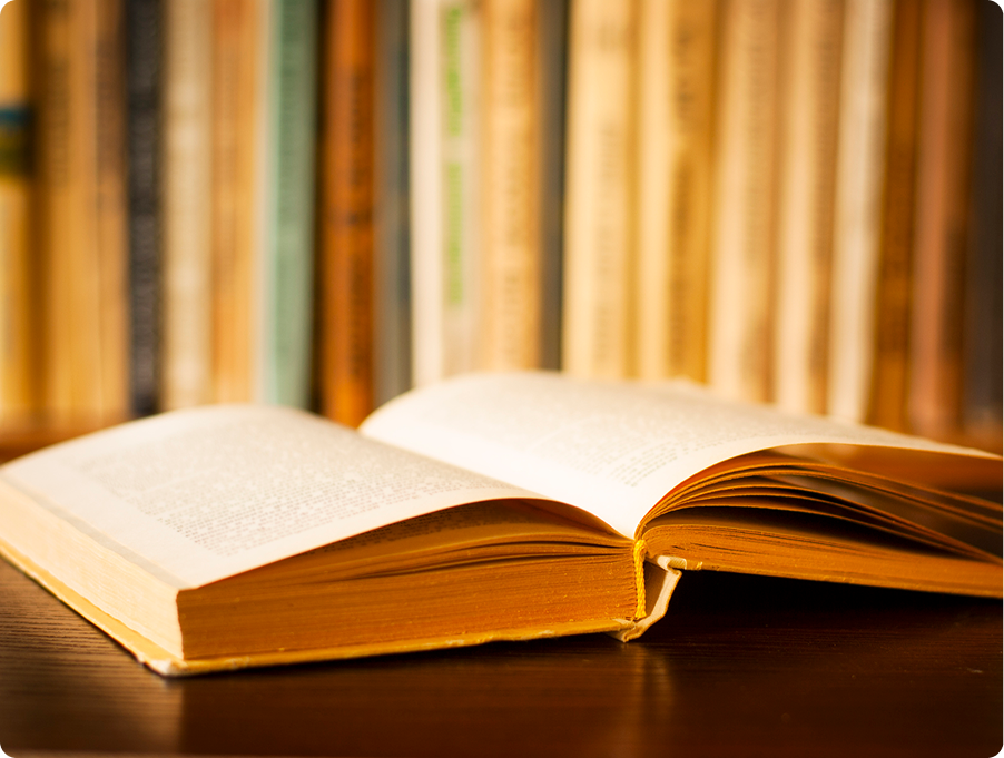 Open book on a wooden table.